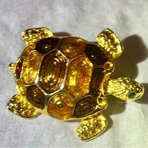 Mio enamel turtle brooch, figural, gold toned metal, brown, gold enamel.